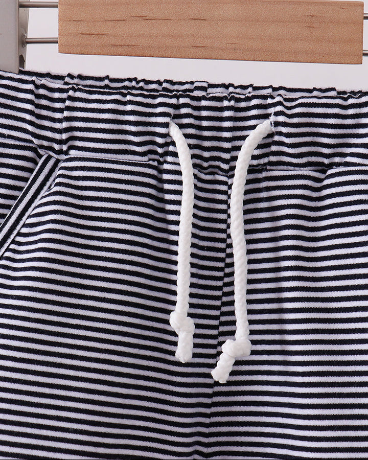 Navy and white striped drawstring shorts with elastic waist and white tie cords