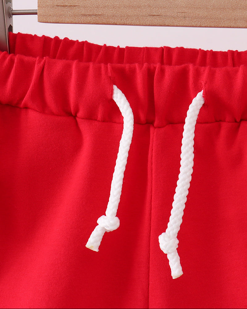 Red drawstring shorts with elastic waist and white braided cords