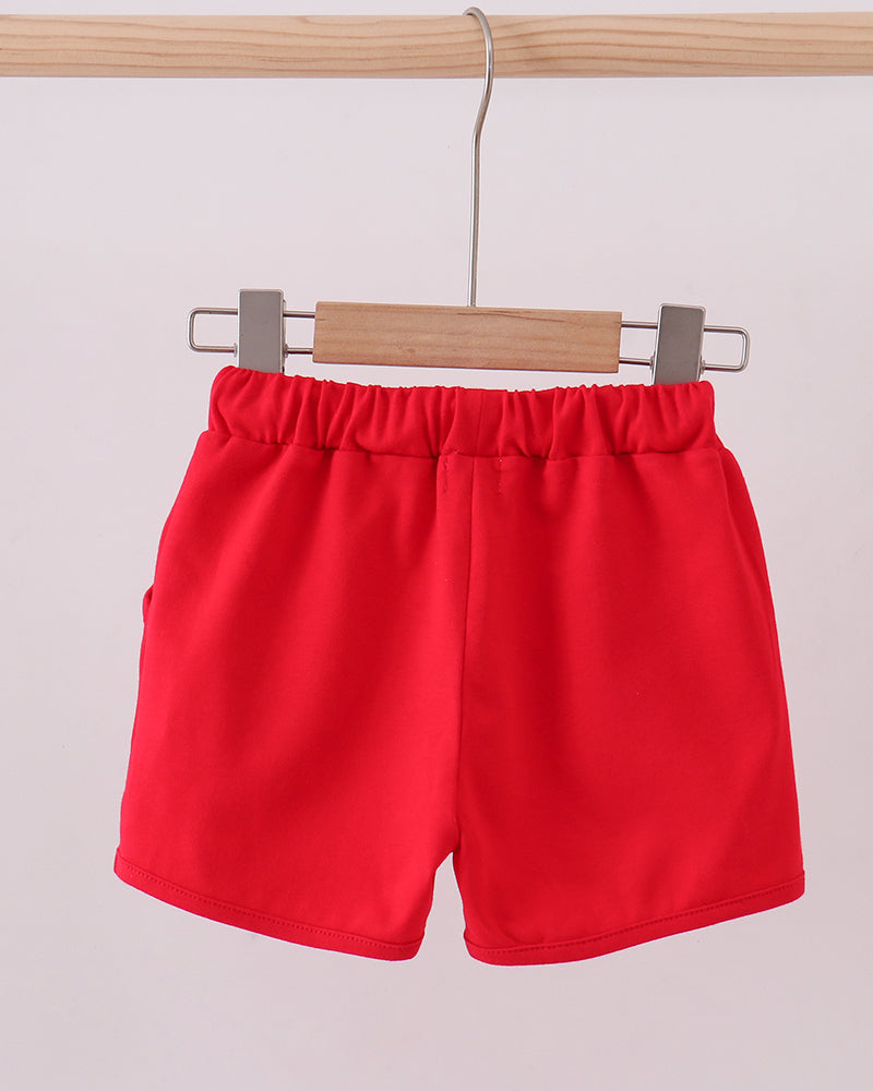 Red drawstring shorts on hanger, elastic waistband with white braided cords