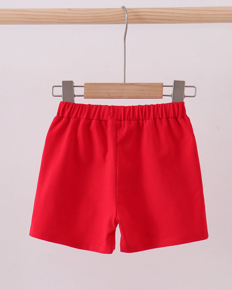 Red kids shorts with elastic waistband and side pockets, front view