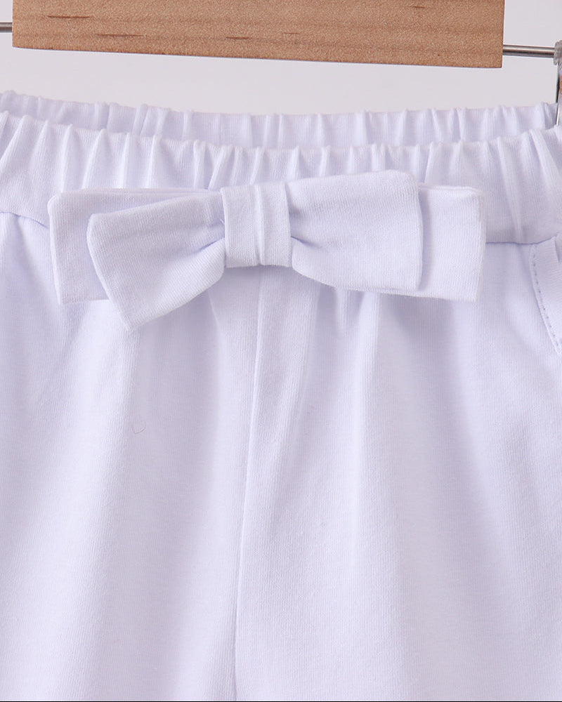 White shorts with elastic waistband and front bow detail