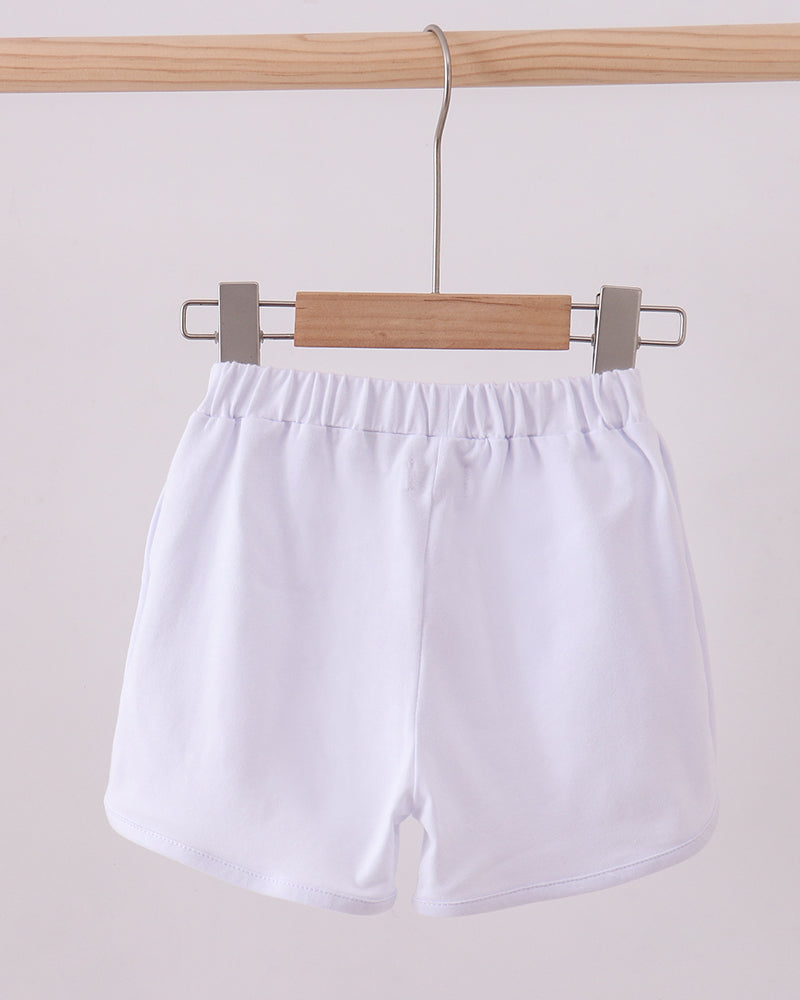 White bow shorts on hanger, elastic waistband and gathered top
