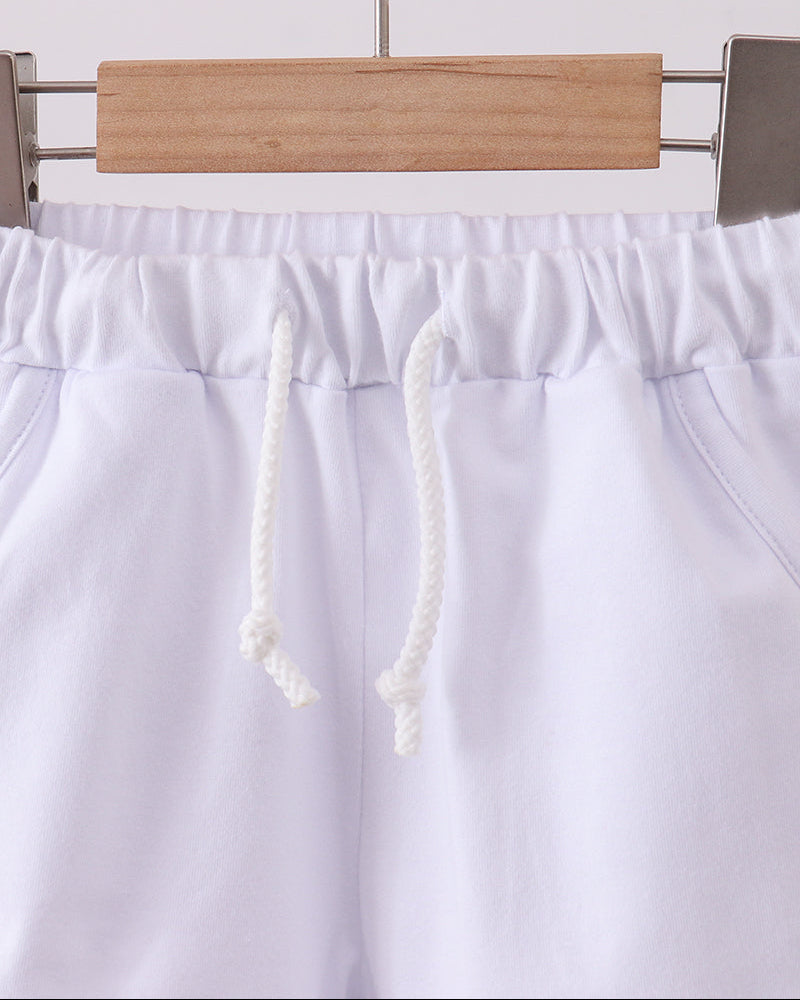 White drawstring shorts with elastic waist and gathered waistband, front view