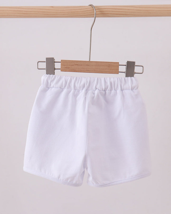 White elastic-waist drawstring shorts hanging, front view