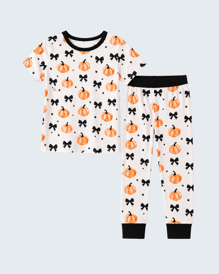 Bamboo pajama set for kids: white top and pants with orange pumpkin and black bow print