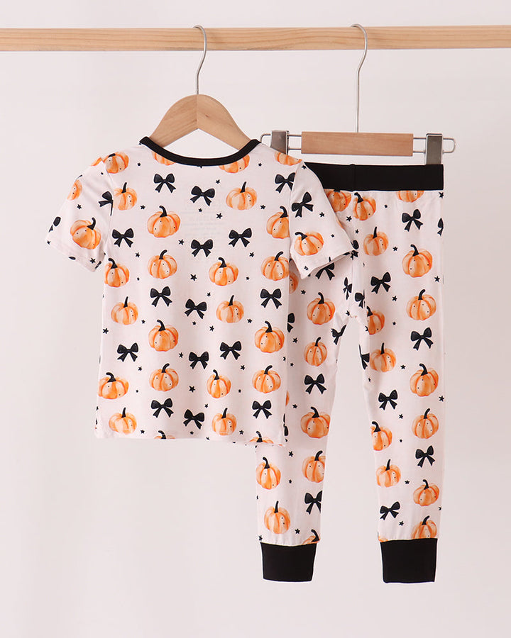 Kids bamboo pajama set, white with orange pumpkin and black bow prints, long pants