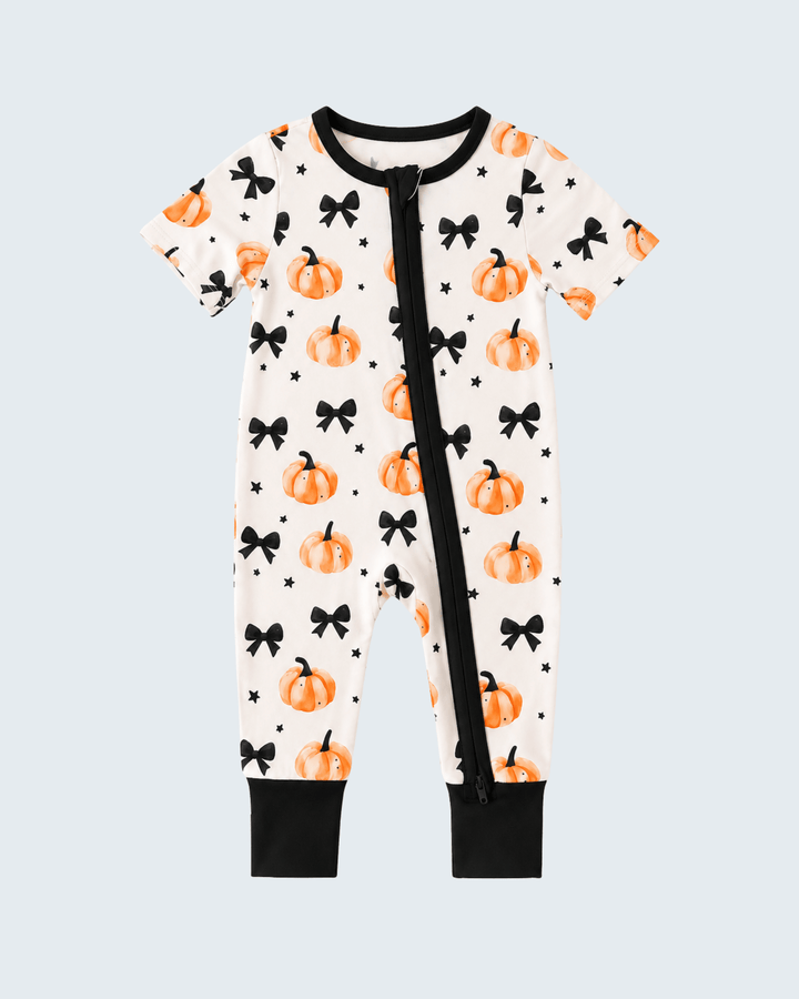 Bamboo zip romper with orange pumpkins, black bows, black trim, short sleeves