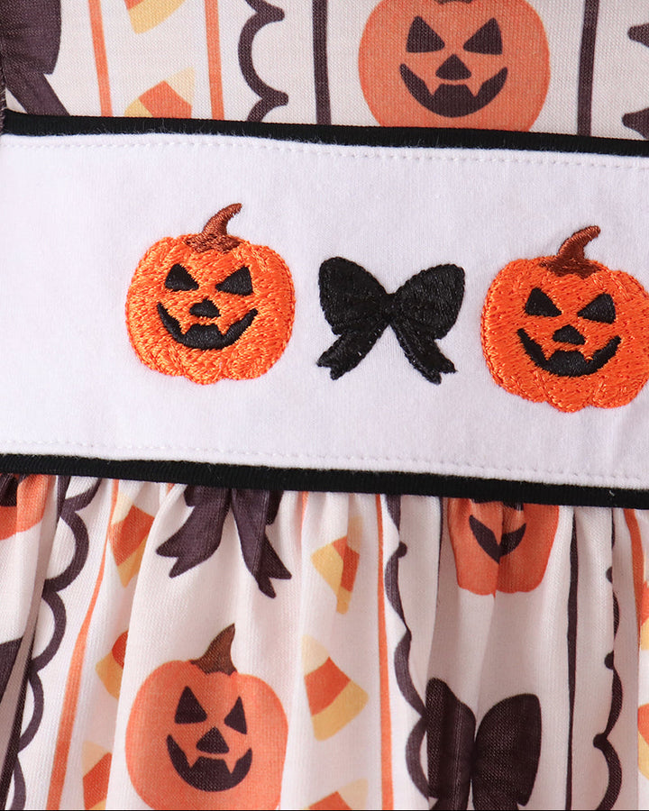 White bloomer waistband with embroidered orange pumpkins and black bow accents