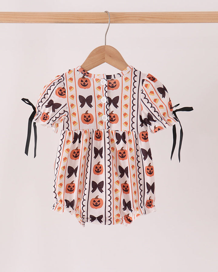 White Halloween bubble romper with pumpkin embroidery, black ruffle collar, fringe sleeves and bows