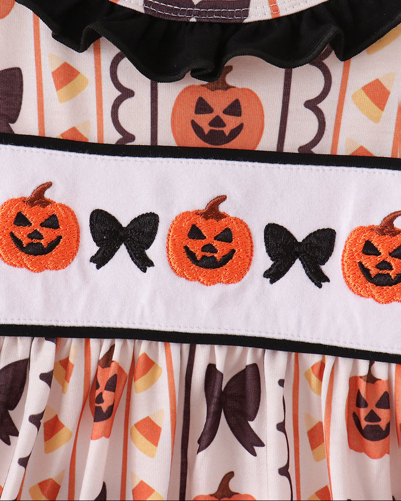 Embroidered ruffle dress yoke with orange pumpkins and black bats, bow trim at neck