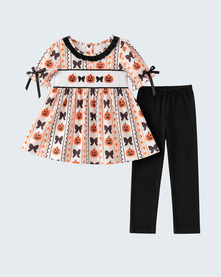 Two-piece outfit: patterned ruffle dress with tied bows and black leggings