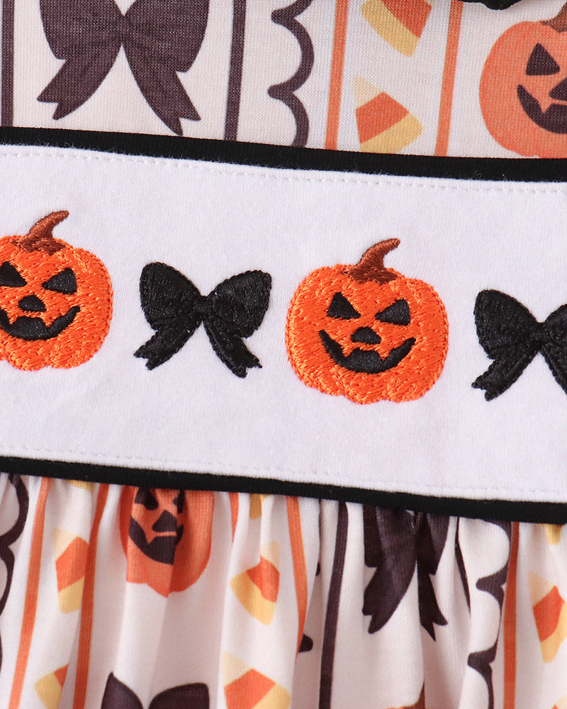Ruffle hem band with orange jack-o-lantern faces, black bats, and black contrast stripe