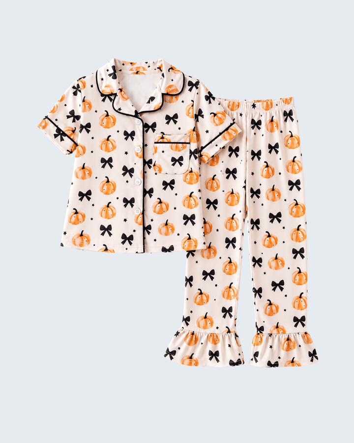 Kids pajama set with short-sleeve button shirt and flared pants, pumpkin and bow print.