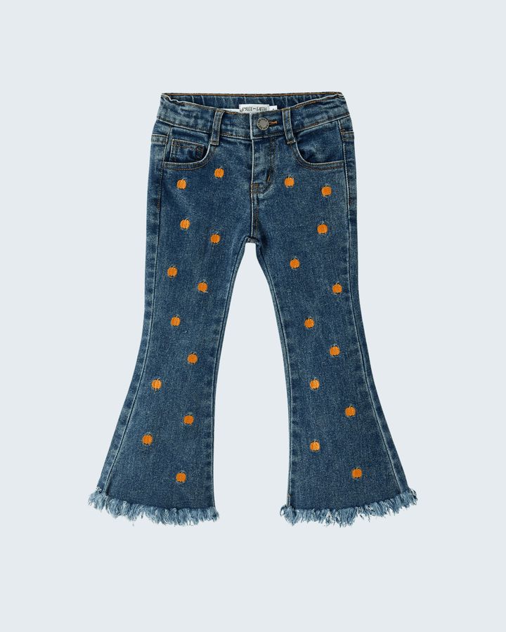 Blue flare jeans covered in orange pumpkin embroidery and frayed bell hem