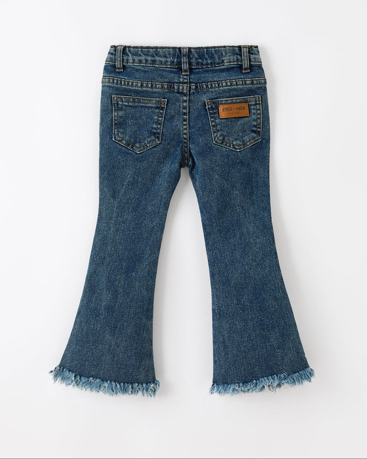 Blue flare jeans with frayed hem and small orange pumpkin embroidery