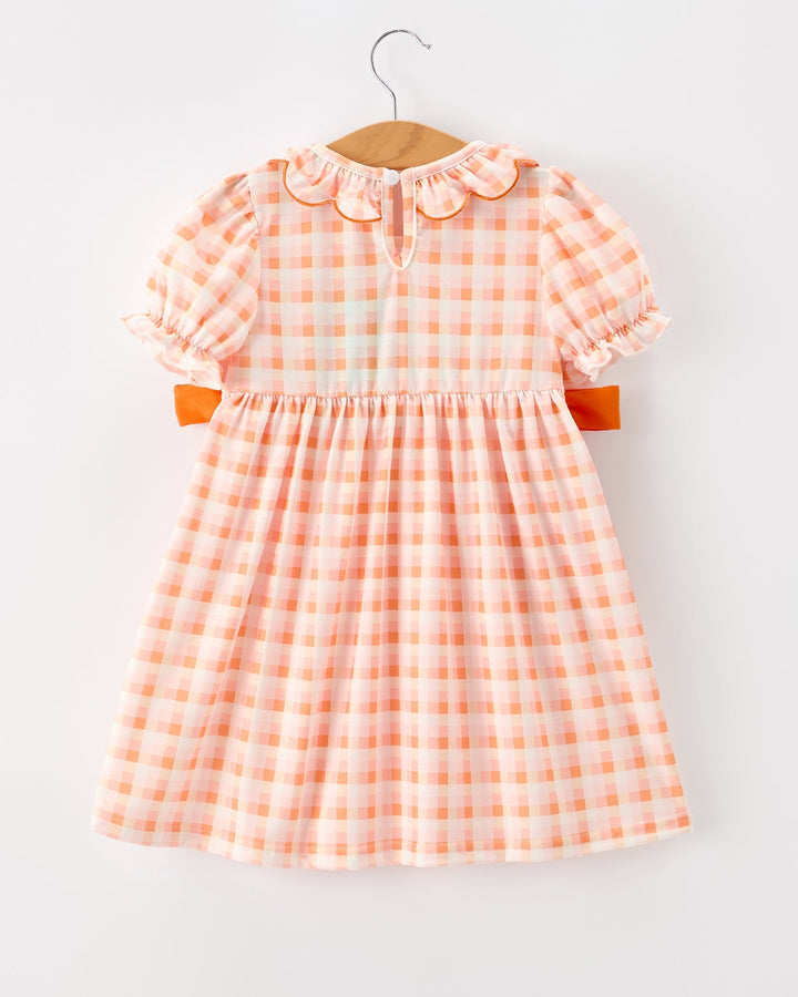 Girls orange plaid pumpkin dress with ruffled neckline and orange side tie bows