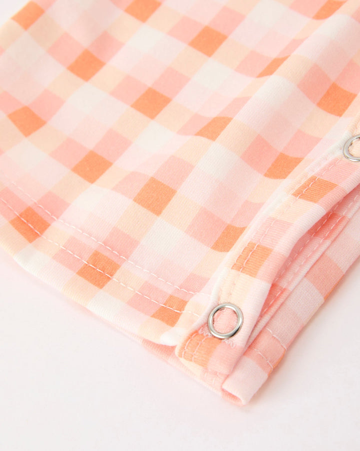 Orange and white plaid jonJon leg hem with button placket and metal snap rings