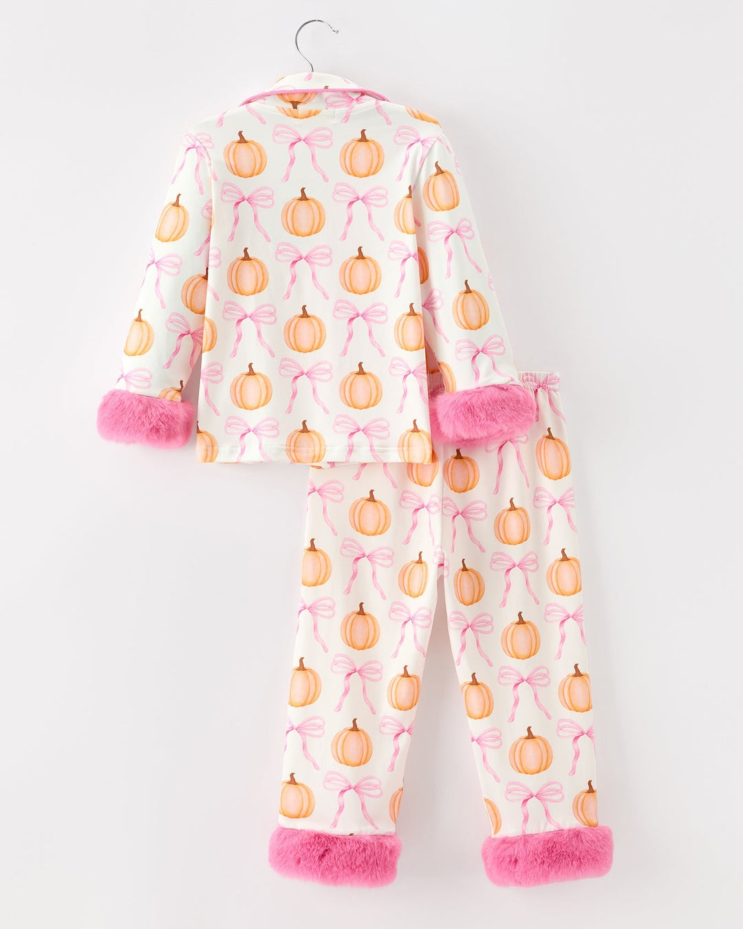 Pink pumpkin-and-bow pajama set with fuzzy cuffs, zip-front hoodie and pants