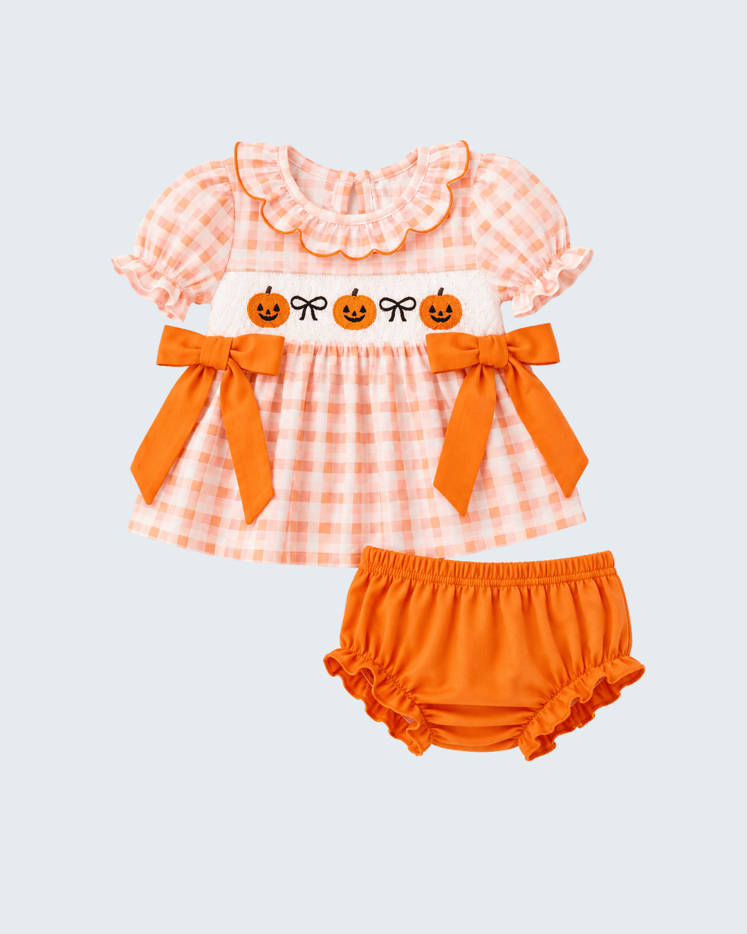 Orange plaid baby bloomer set with pumpkin applique top and bow-trim shorts