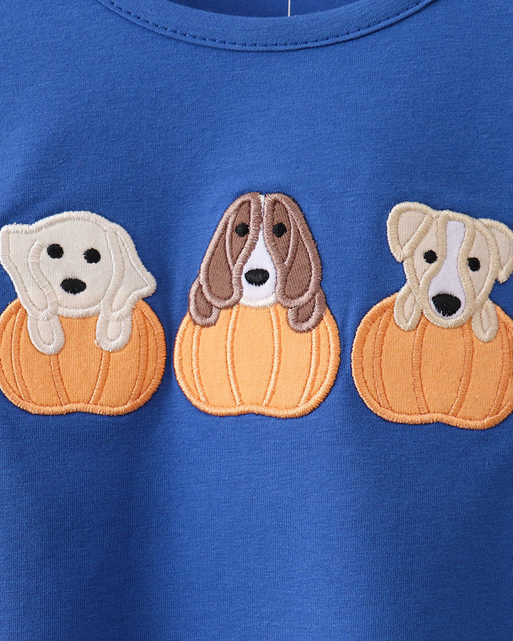Blue embroidered long-sleeve top with three dog faces inside orange pumpkin patches