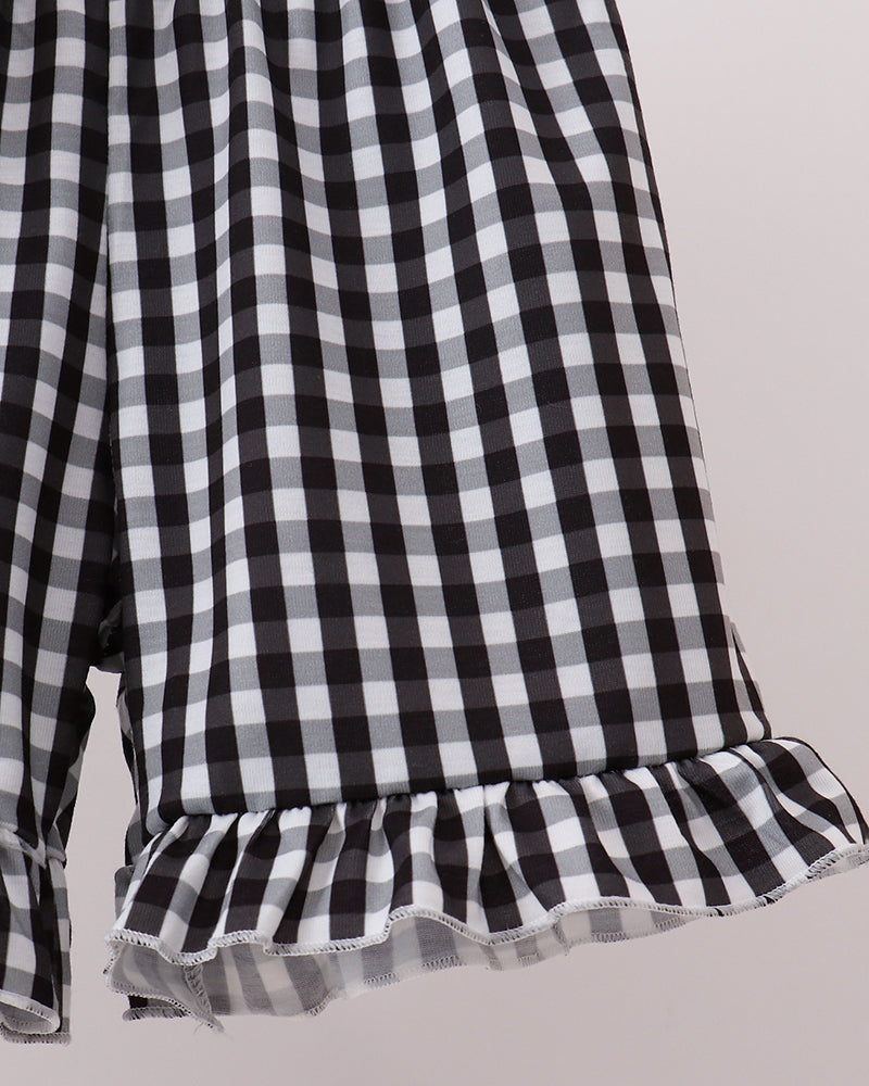 Black-and-white gingham shorts with ruffled hem