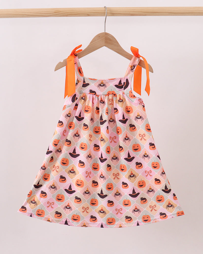 Sleeveless Halloween dress with orange bow straps and pumpkin spider pattern on pink