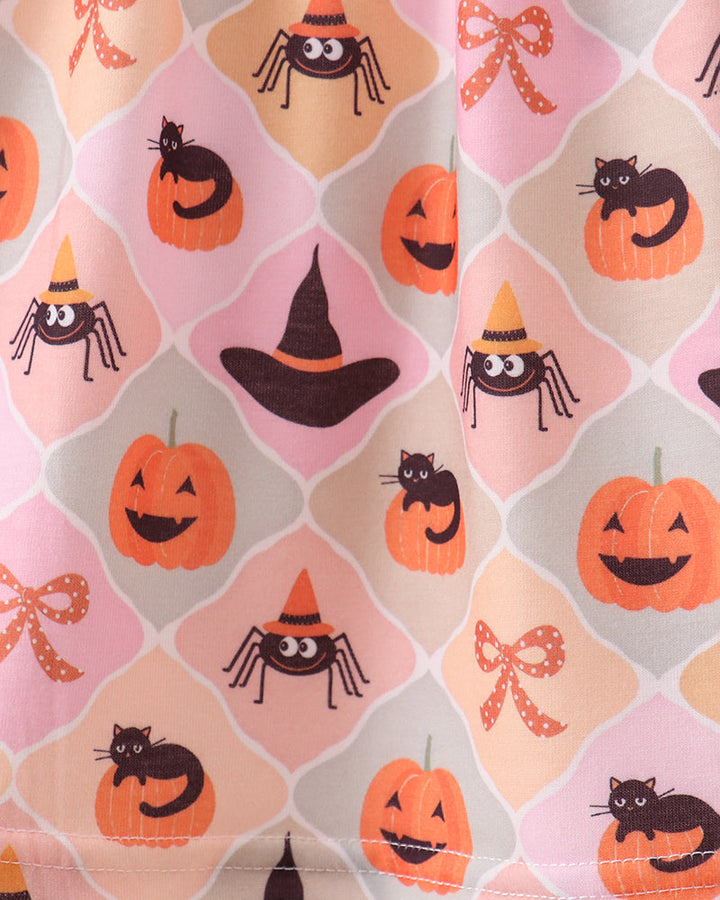 Pumpkin spider print skirt with jack-o-lantern, black cat, and witch hat motifs