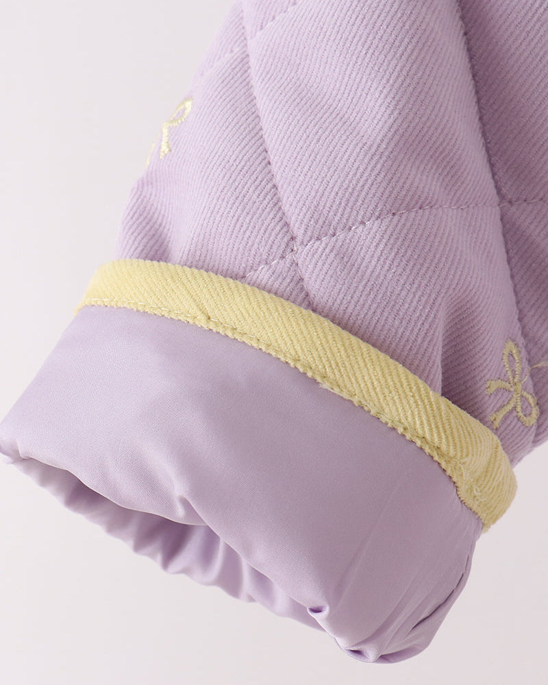 Lavender jacket sleeve cuff with yellow trim and gathered ruffle hem