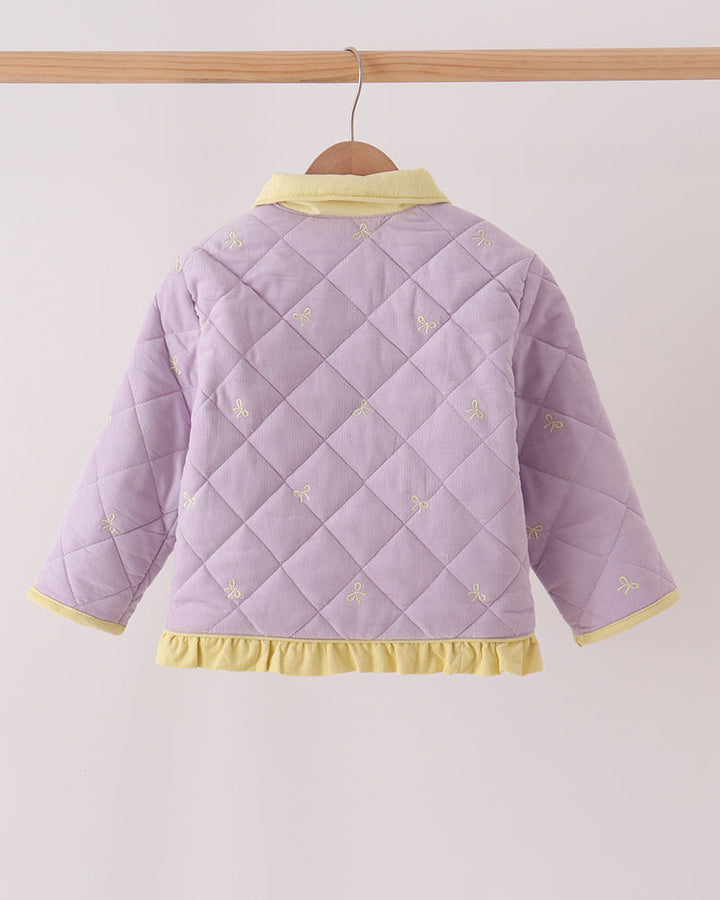 Back of lavender ruffle jacket with yellow collar trim and embroidered details