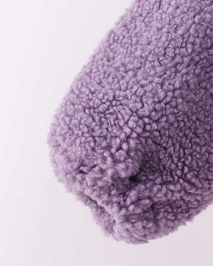 Purple fuzzy fleece sleeve end with textured rounded cuff
