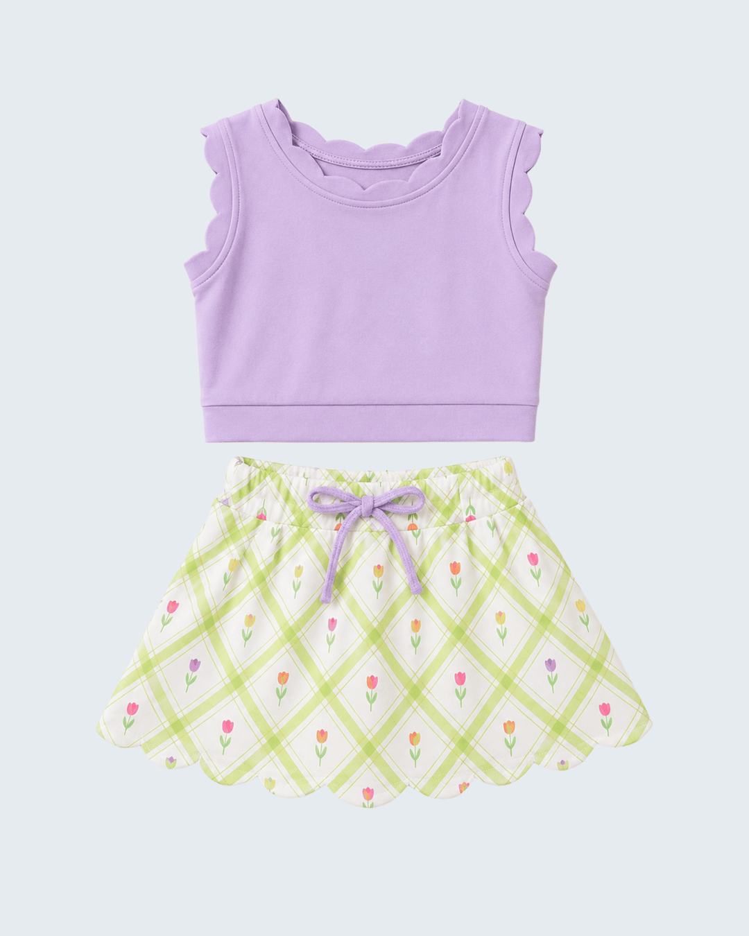 Purple tank top and checkered skirt set on a light purple background