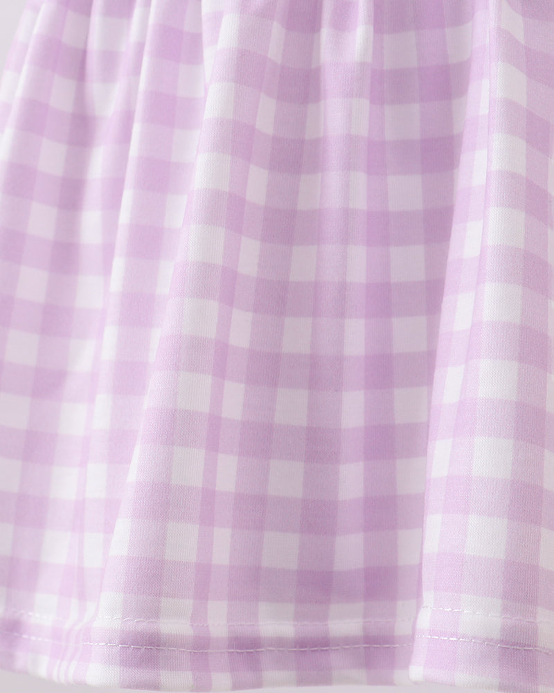 Close-up of a purple and white checkered fabric