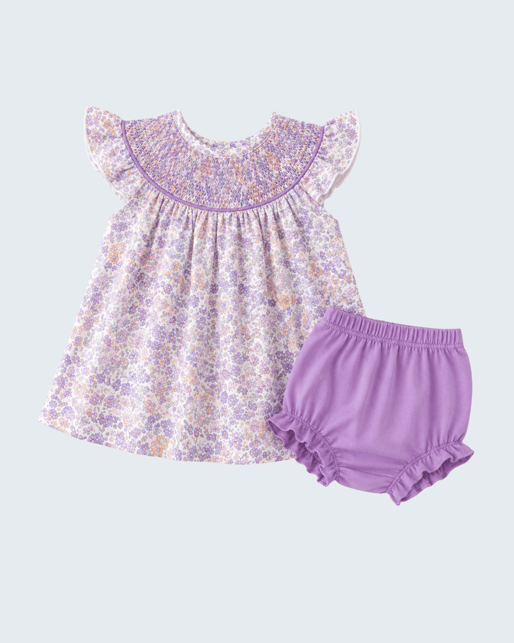 Floral dress with ruffled sleeves and matching bloomers on a light purple background