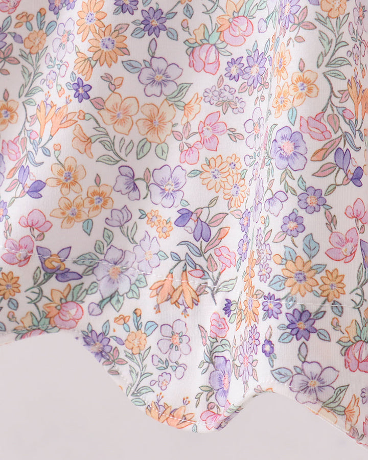 Floral patterned fabric with colorful flowers on a white background