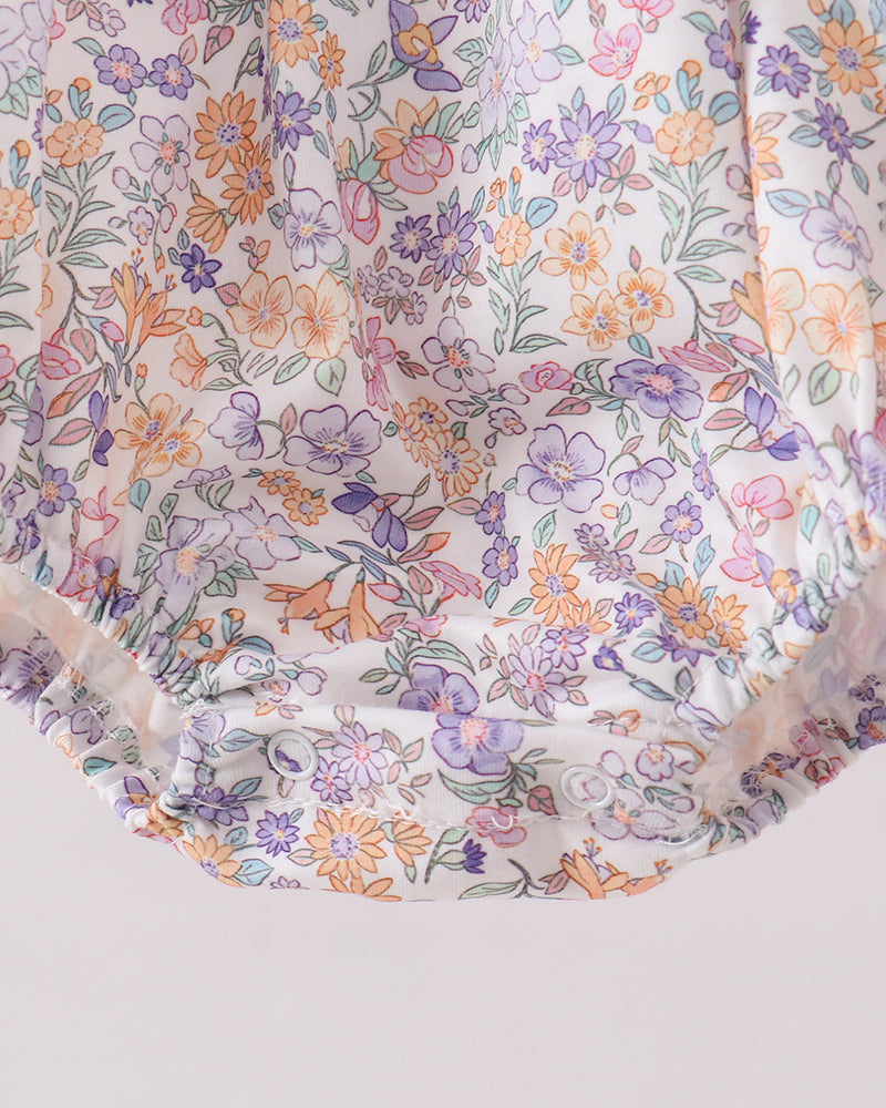 Floral patterned fabric with colorful flowers on a white background