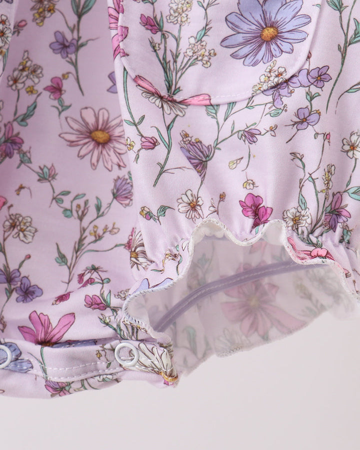 Floral patterned fabric with a focus on a sheer overlay