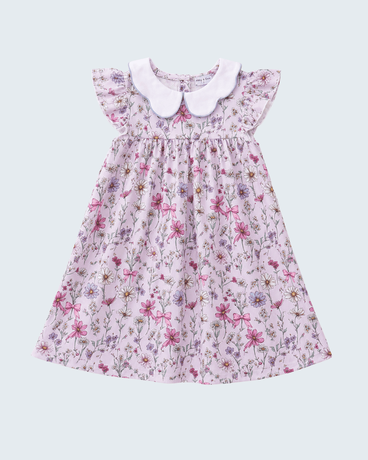Floral dress with a white collar on a light gray background