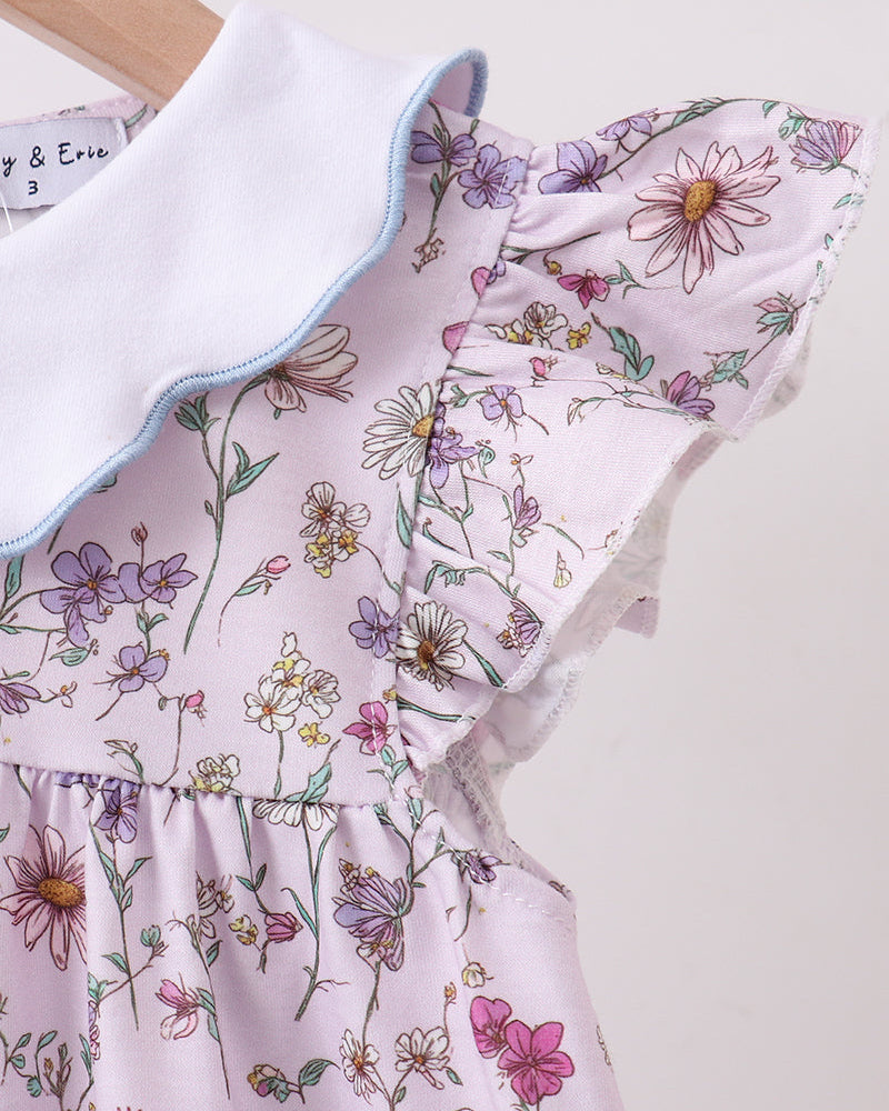 Floral dress with ruffled collar on a light background