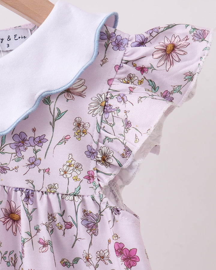 Floral dress with ruffled collar on a light background