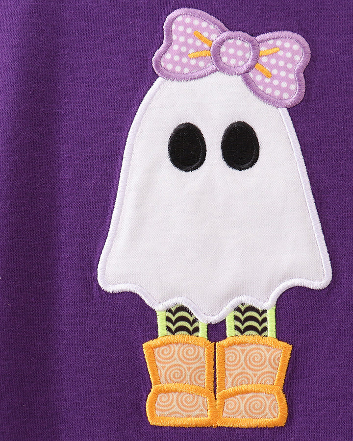Purple top close-up: embroidered white ghost with polka-dot bow and orange boots