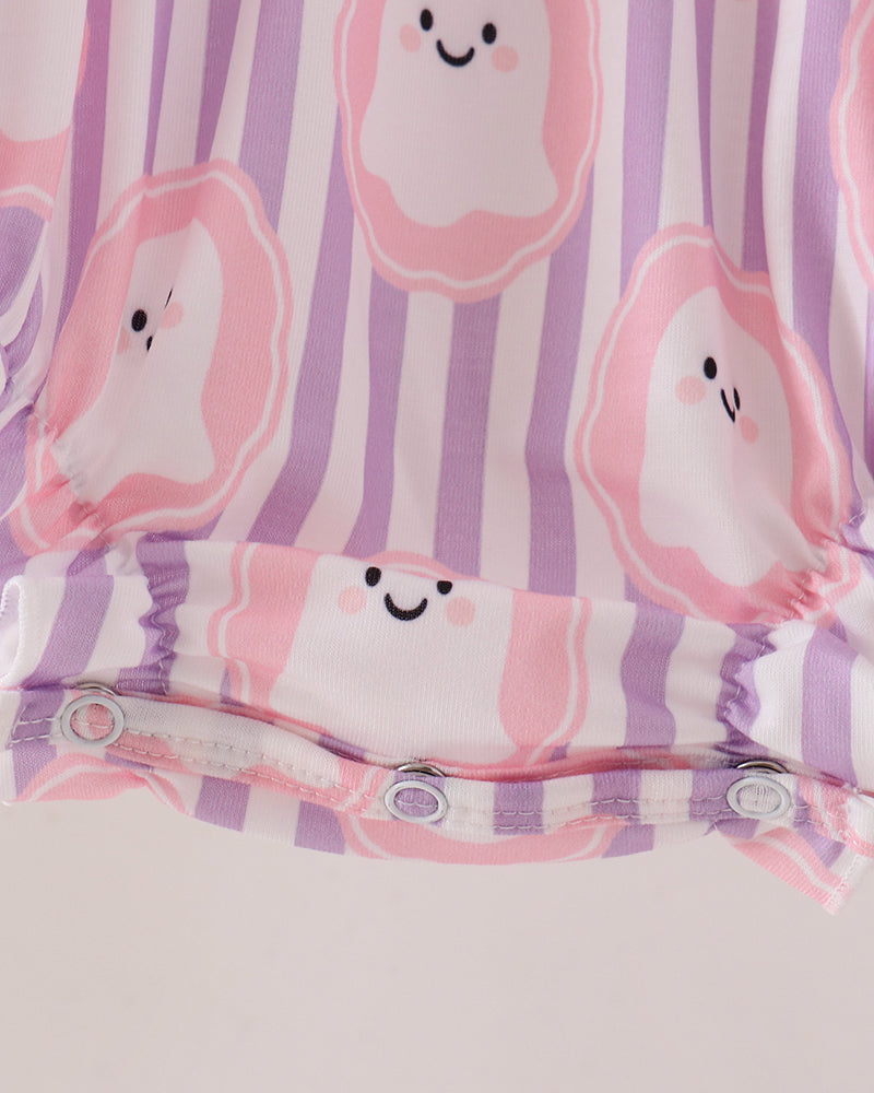 Close-up of a baby romper or bodysuit with a pink and purple striped pattern and cute smiling ghost-like cartoon prints. The bottom has snap closures.