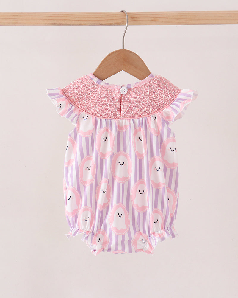 A baby romper with a pink smocked collar and a pink, purple, and white striped body with cute bunny face prints, hanging on a wooden hanger.