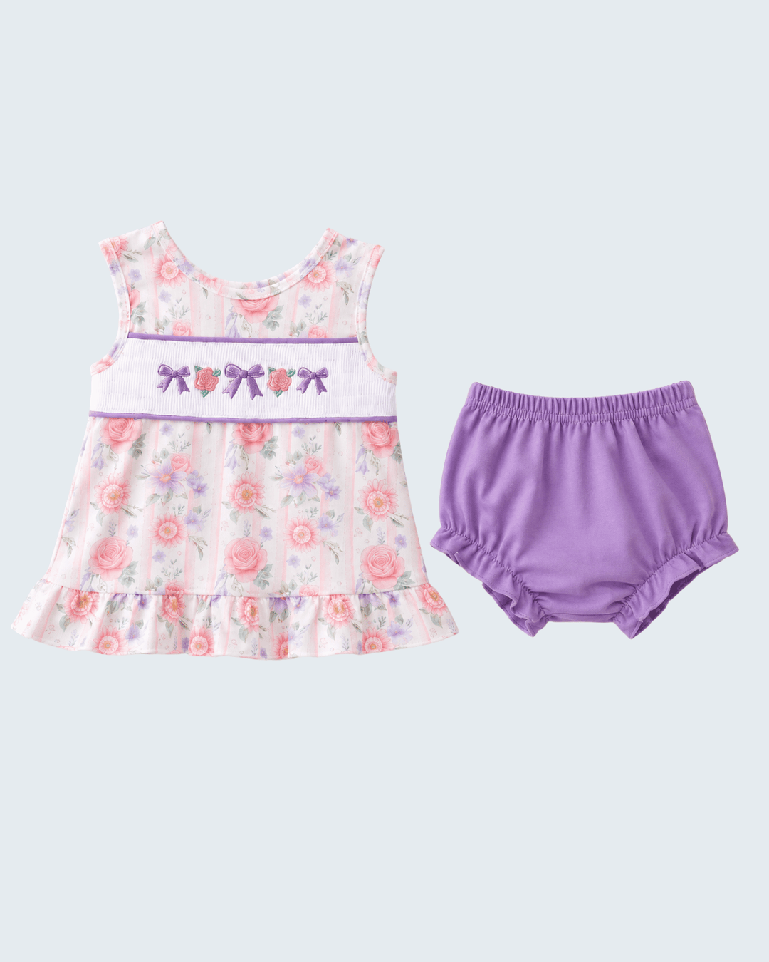 Floral dress with butterfly design and purple bloomers on a light gray background