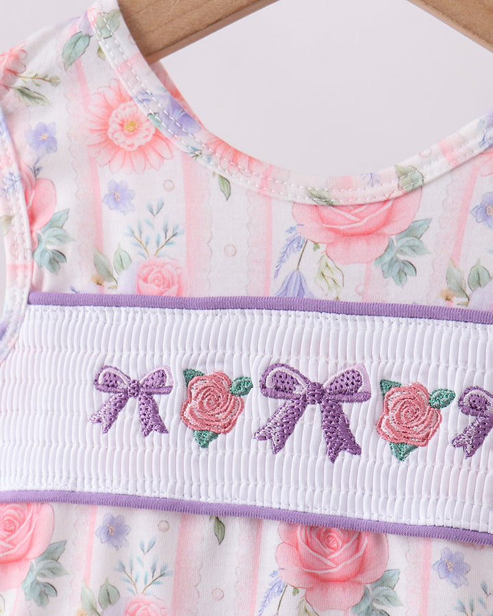 Floral dress with embroidered details on a wooden surface