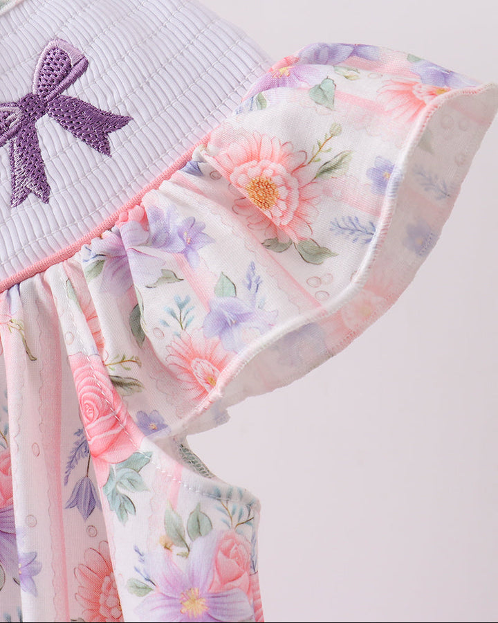 Close up of floral cap sleeves on dress