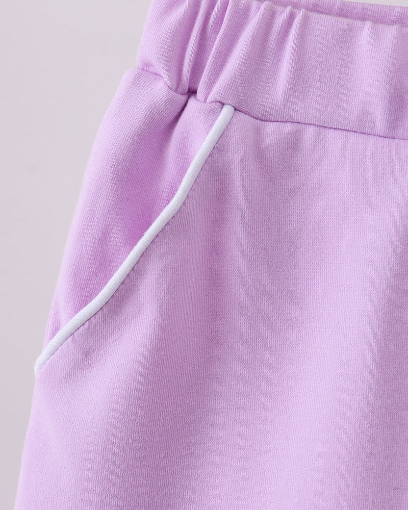 Lavender purple skort with scallop hem and bow-tie waistband, side tie detail
