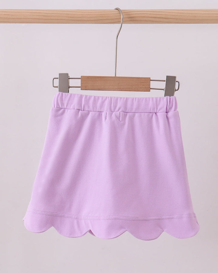 Lavender purple skort with elastic waistband and scalloped hem, front view