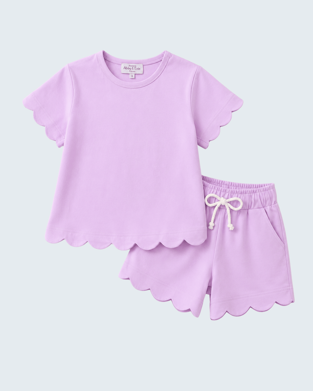 Lavender shorts set with scalloped edges on a white background