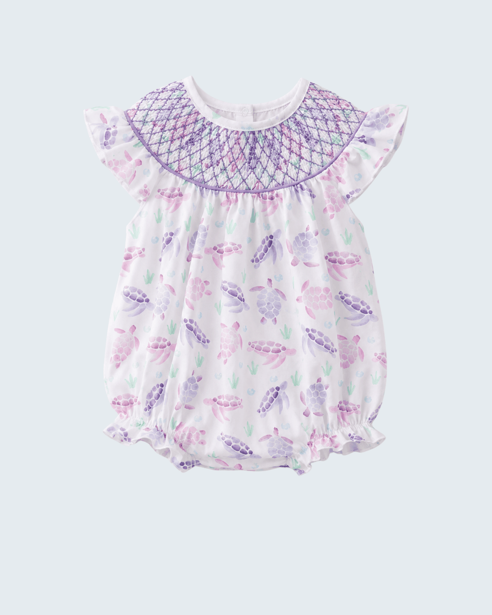 Baby romper with butterfly pattern on a light purple background