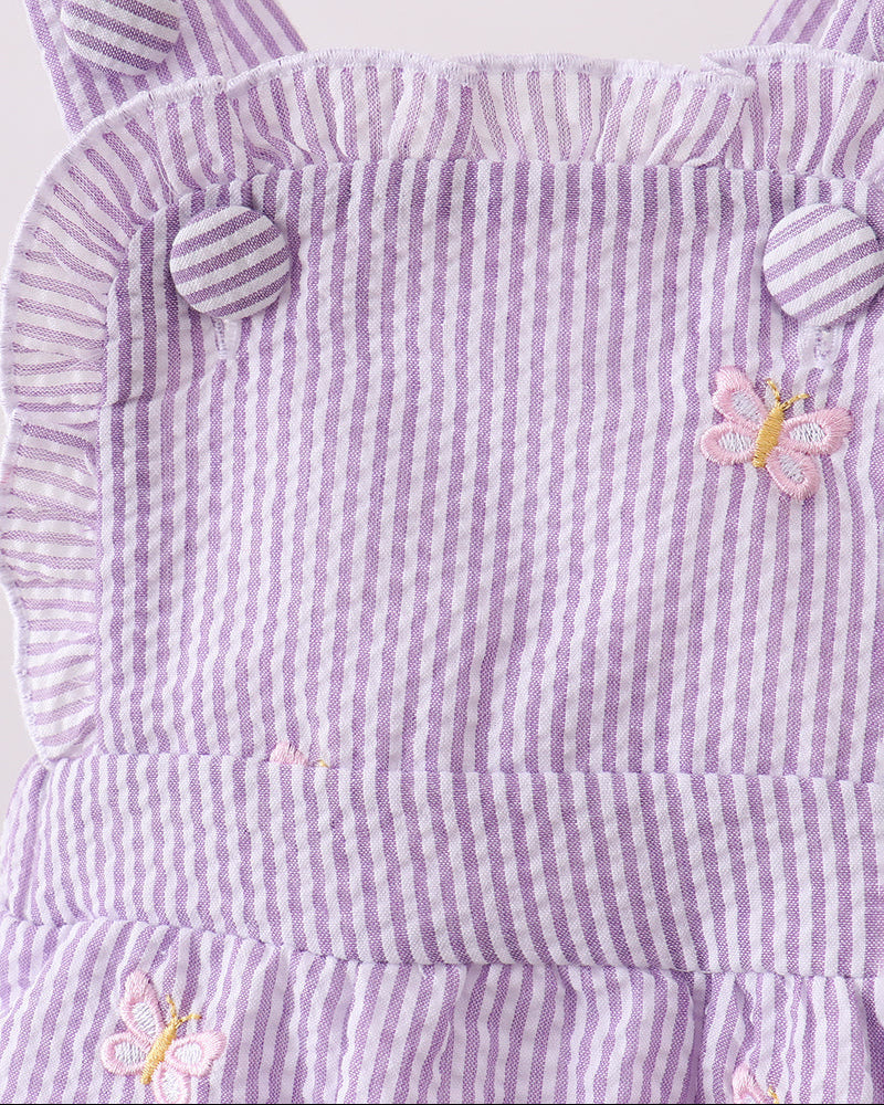 Purple and white striped dress with butterfly designs on a white background